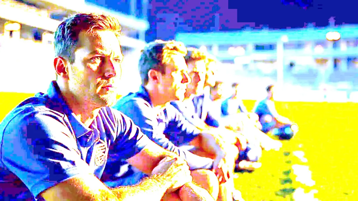 Cricket players waiting beside a real floodlit ground before a night fixture, kit bags and helmets arranged accurately